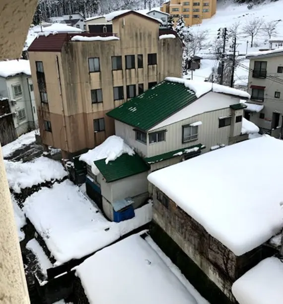 Snow on the rooftops in Yuzawa, our first snow
