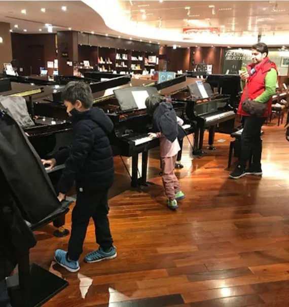 Trying the pianos at the Yamaha Music shop in Ginza