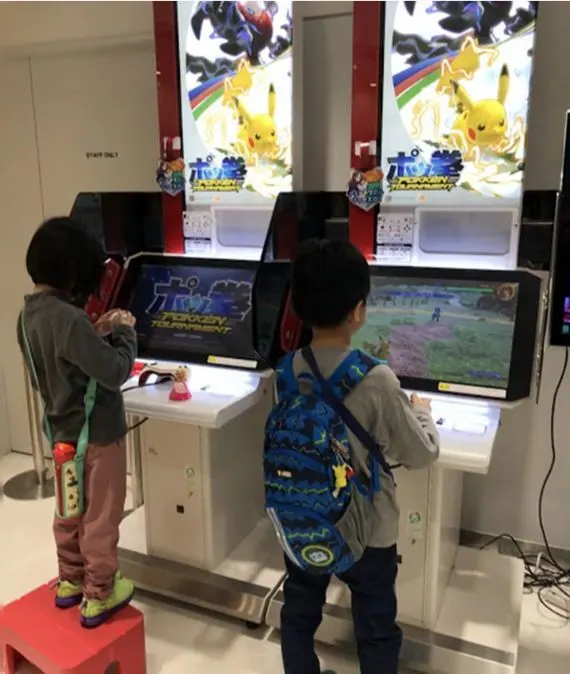 Playing games at the Pokémon Center Mega Tokyo